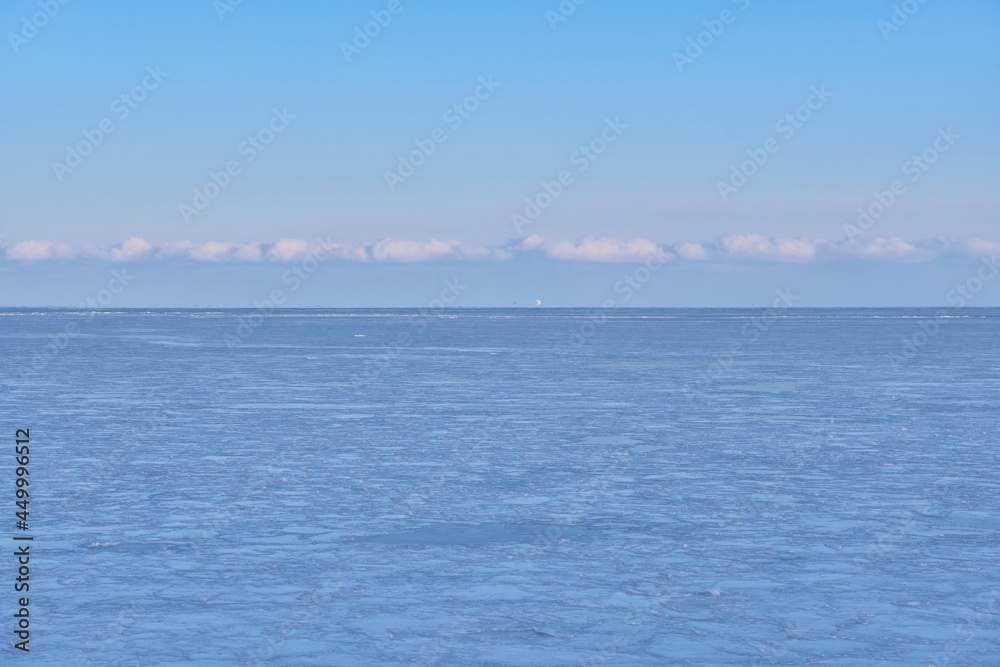 Vanino, Russia - Jan 18, 2021: Vanino Bay in the Tatar Strait in winter. The frozen sea.