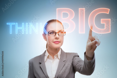 Think big concept with businesswoman