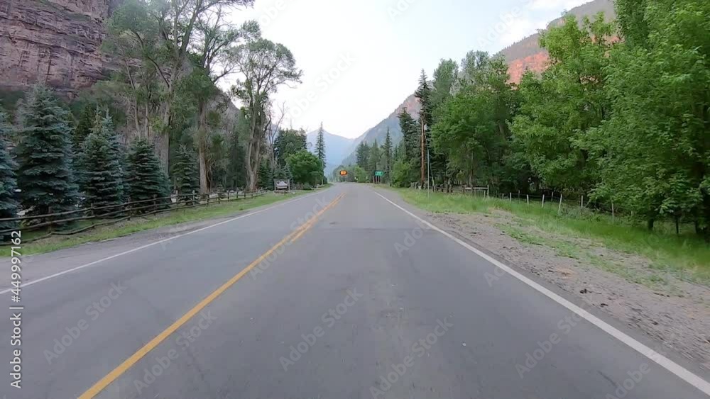 POV while driving on Highway 550 through Uncompahgre River valley near Ouray Colorado; passing Rotary Park and a sign warning to watch for wildlife POV while driving on Highway 550 through Uncompahgre River valley near Ouray Colorado; passing Rotary Park and a sign warning to watch for wildlife