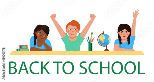 Girls and a boy are sitting at a desk at school. An African-American schoolgirl and white schoolchildren in the classroom. Back to school. Vector illustration in a flat cartoon style