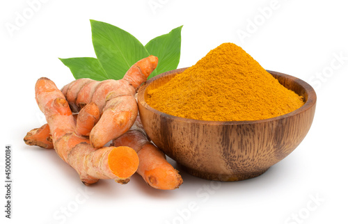 Turmeric (Curcuma longa Linn, curcumin ) powder in the wooden bow and rhizomes (root) sliced with leaves isolated on white background, as herbal medicine, natural fabric dye.