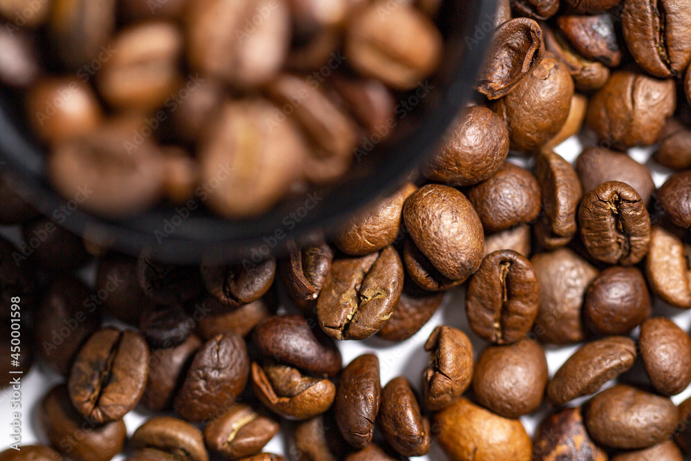 Fototapeta premium Selective focus on coffee beans, top view.
