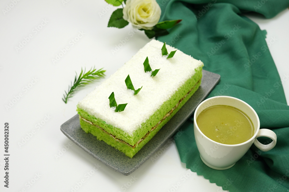 Pandan sponge cake with coconut, cream, butter and green tea. 