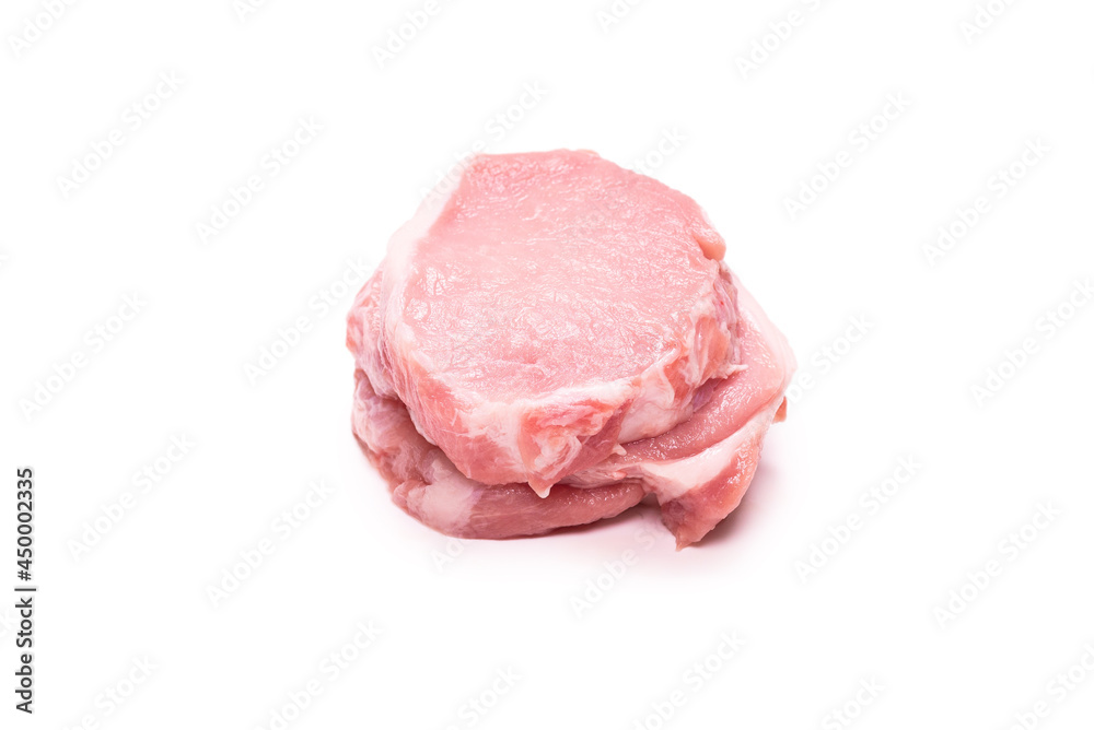 Raw pork pieces isolated on a white background.