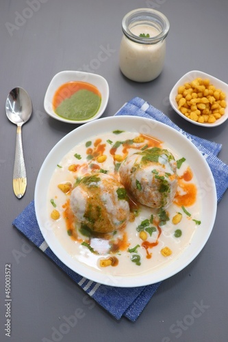 Dahi Bhalla or Dahi Vada is a type of chaat dish from India. It is prepared by soaking urad dal vadas in creamy yogurt with green and red chutney. Tri color dish. Indian Tiranga Flag colors food.