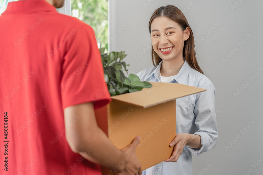 Happy, smile asian young pretty woman unpacking carton parcel, holding plant pot for interior before cargo company, delivery man, male packing cardboard box. Moving, preparing in new house, relocation Happy, smile asian young pretty woman unpacking carton parcel, holding plant pot for interior before cargo company, delivery man, male packing cardboard box. Moving, preparing in new house, relocation