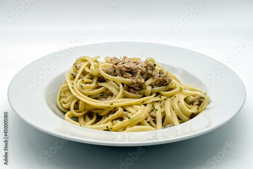 Spaghetti with tuna, lemon and Parmigiano Reggiano cheese.