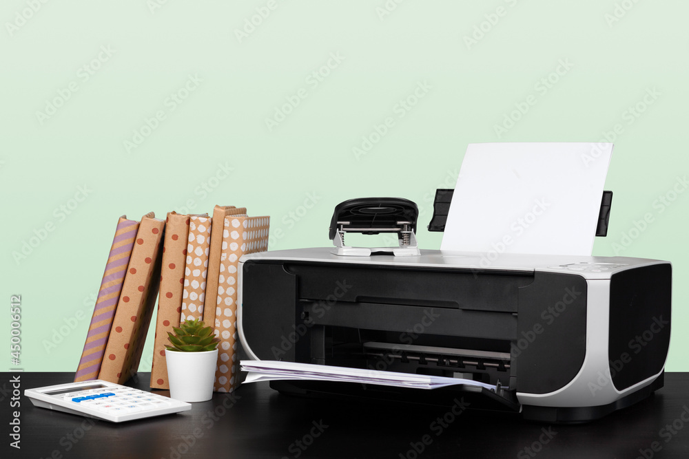 Fototapeta premium Compact home laser printer against gray background