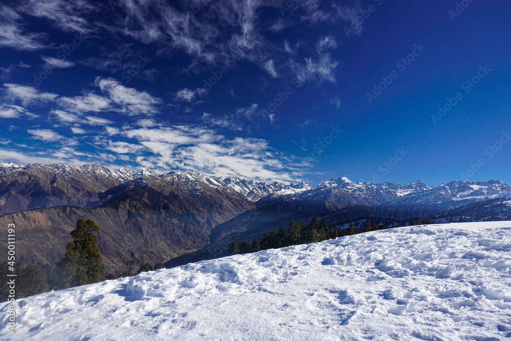 landscape of snow mountains along trek of kederkantha