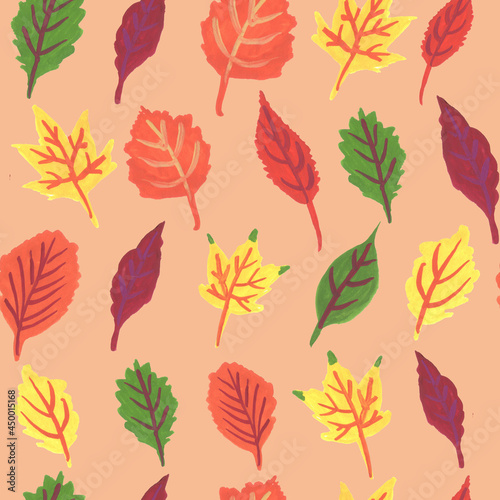 seamless pattern with colorful autumn leaves on beige background