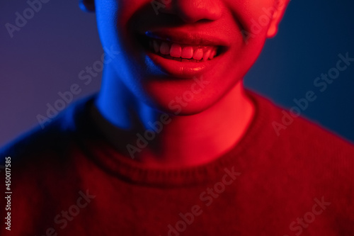 neon light smile positive emotion man face red