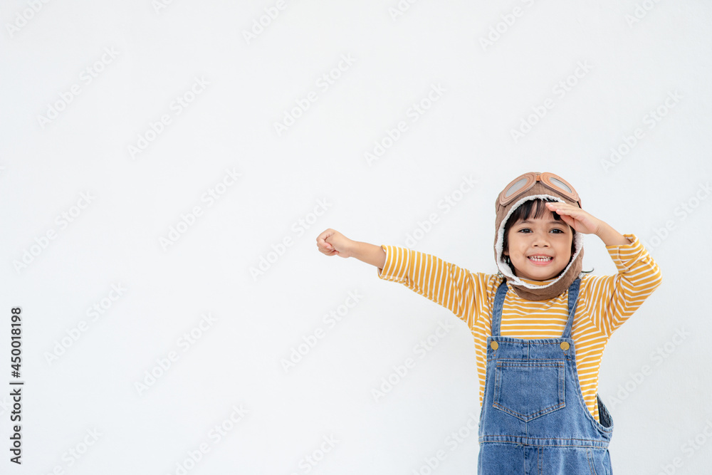 dreams of flight! little child girl playing with a pilot hat on white background dreams of flight! little child girl playing with a pilot hat on white background