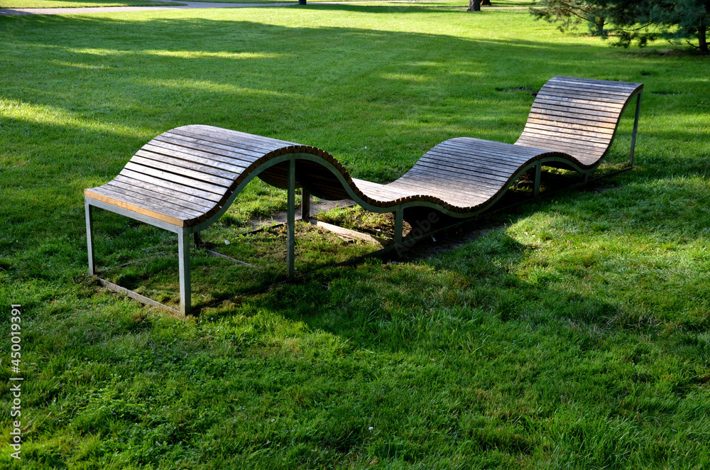 Bumpy Textured Bench Design design bench in the shape of a wavy line. wooden paneling on a metal ...