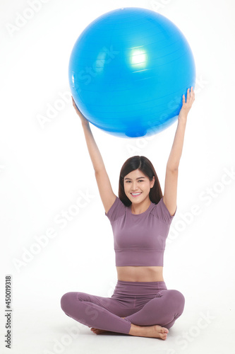 Healthy beautiful Asian woman Put on exercise clothes, play yoga ball. on a white background. weight loss exercise concept