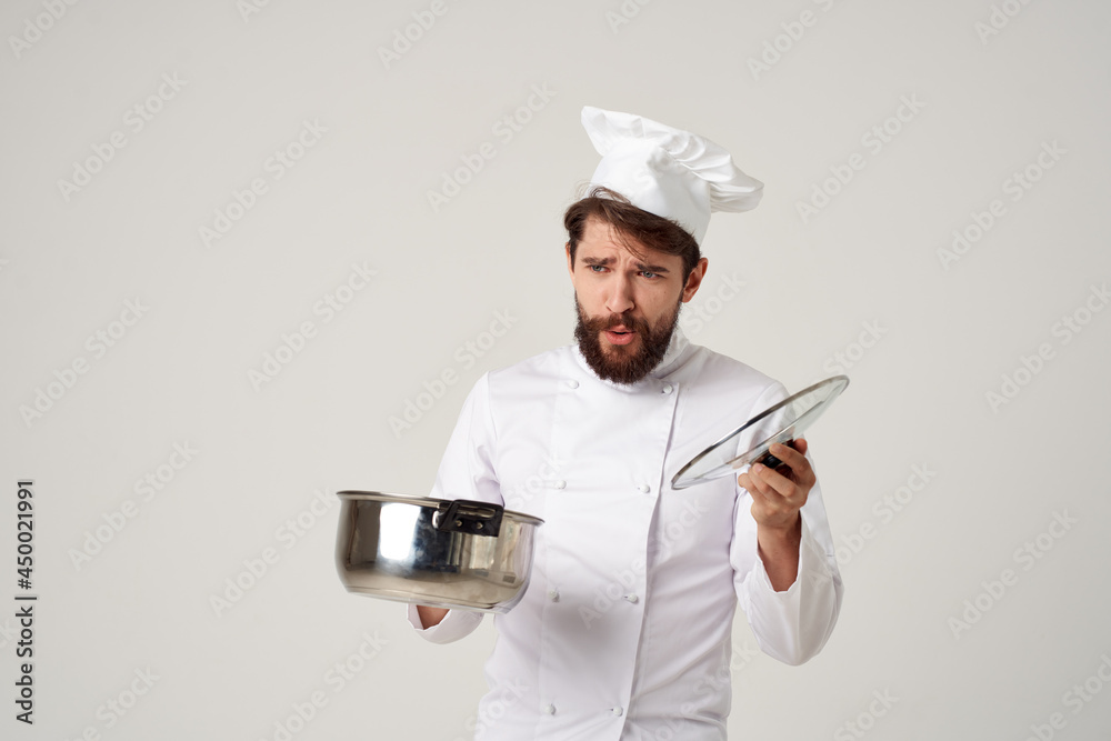 male chef with a saucepan in his hands kitchen recipe dishes male chef with a saucepan in his hands kitchen recipe dishes