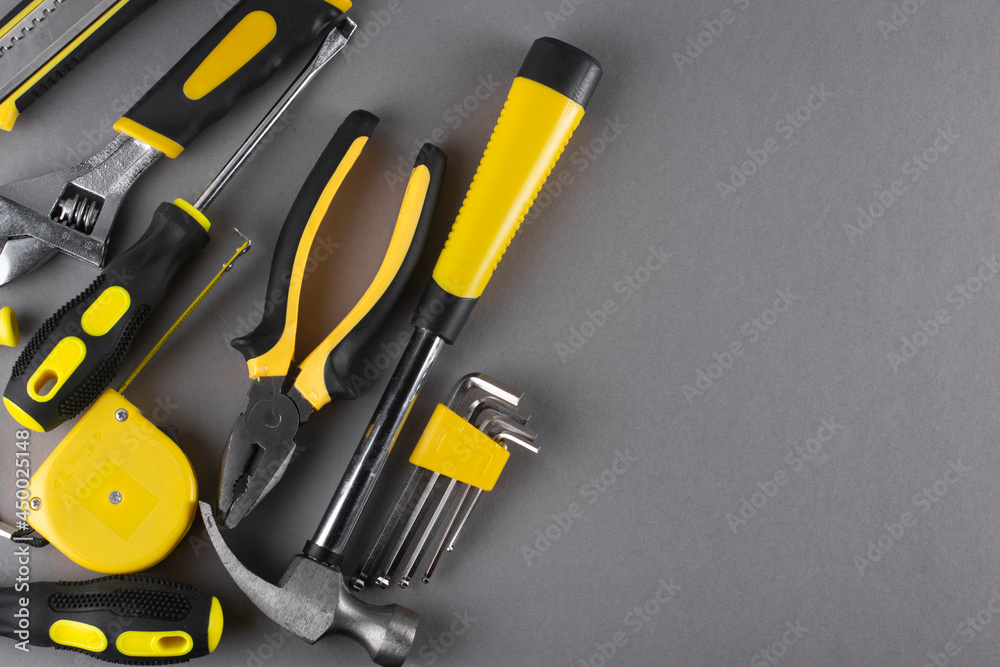 Set of hand tools on a gray background. Copy space.