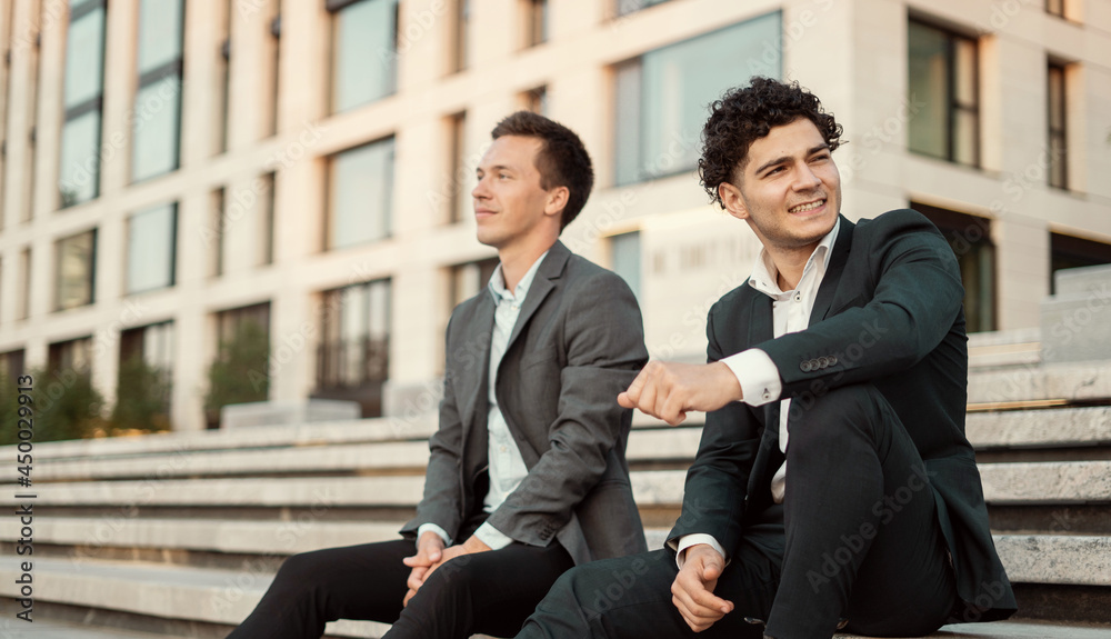 Managers are discussing a new project order. Two male student lawyers in a business suit are sitting near work in a new office. Traders take a break for a minute. Managers are discussing a new project order. Two male student lawyers in a business suit are sitting near work in a new office. Traders take a break for a minute.
