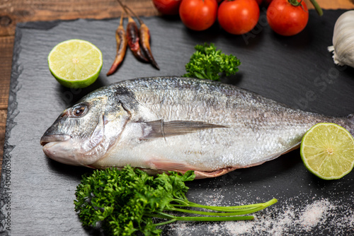 Sea bream and ingredients for cooking