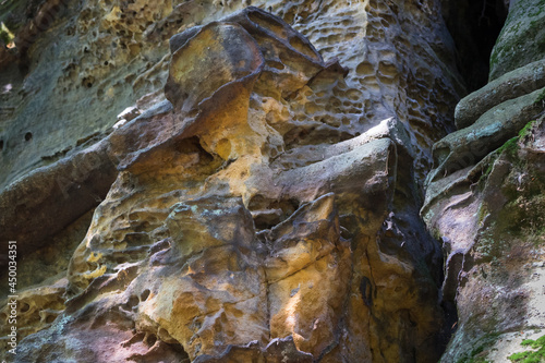 ancient rock face of the eroded sandstone in the mountains abstract background