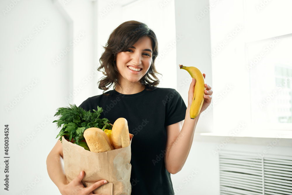 woman in black t-shirt package with groceries shopping homework woman in black t-shirt package with groceries shopping homework