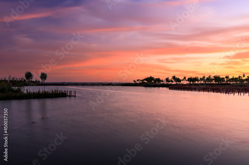 Lake and natural scenery in the park at sunset in summer, Asia