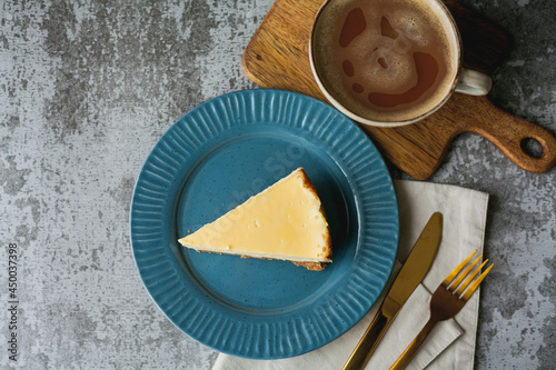 Bakery products. A piece of homemade cheesecake and a mug of coffee. Dessert.