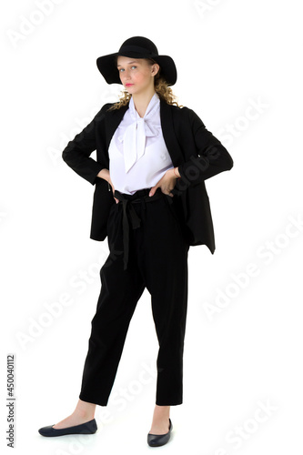 Elegant beautiful girl in a fashionable black suit