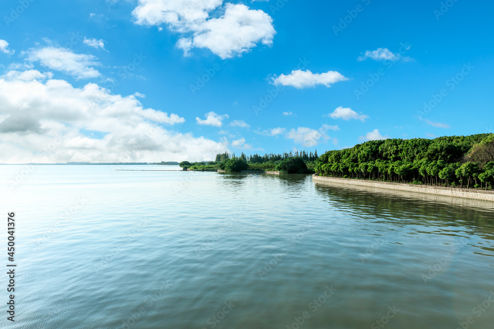 Outdoor tranquil water surface and sky natural landscape in summer, Asia Outdoor tranquil water surface and sky natural landscape in summer, Asia