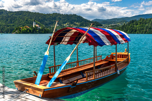 Woodden Boat on Lake Bled Emerald Green Water in Summer in Slovenia