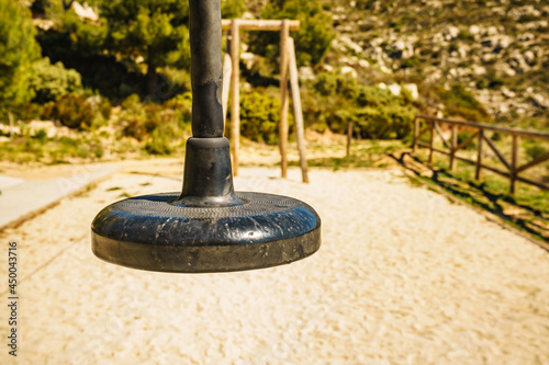 Zip wire with empty seat at playground photo