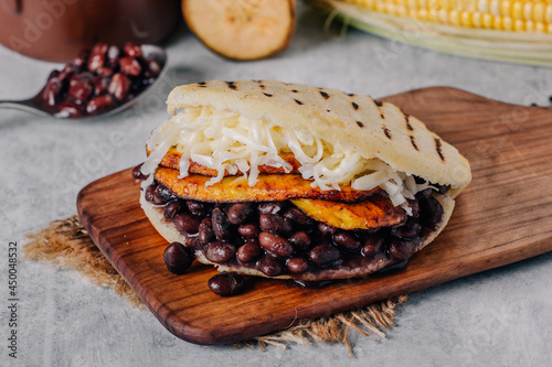  Typical Venezuelan arepa, made with fried plantain, black beans and cheese photo