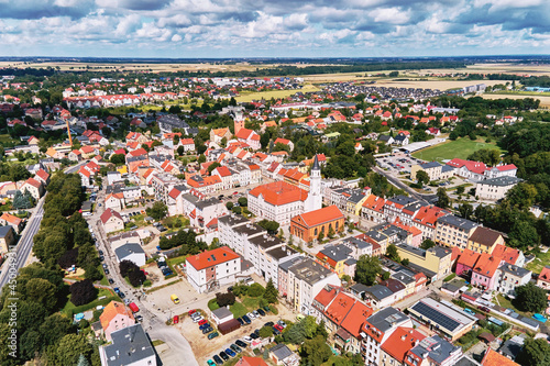 Fototapeta Naklejka Na Ścianę i Meble -  Aerial view of small european city with city streets and residential buildings. Katy Wroclawskie panoramic cityscape