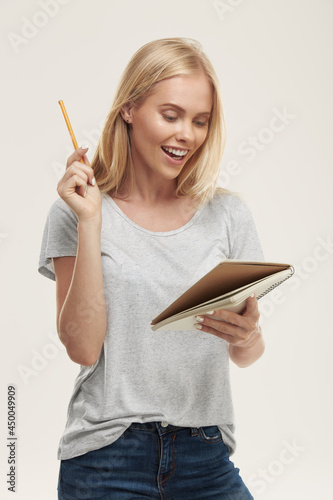 Girl watch something in notebook and have idea