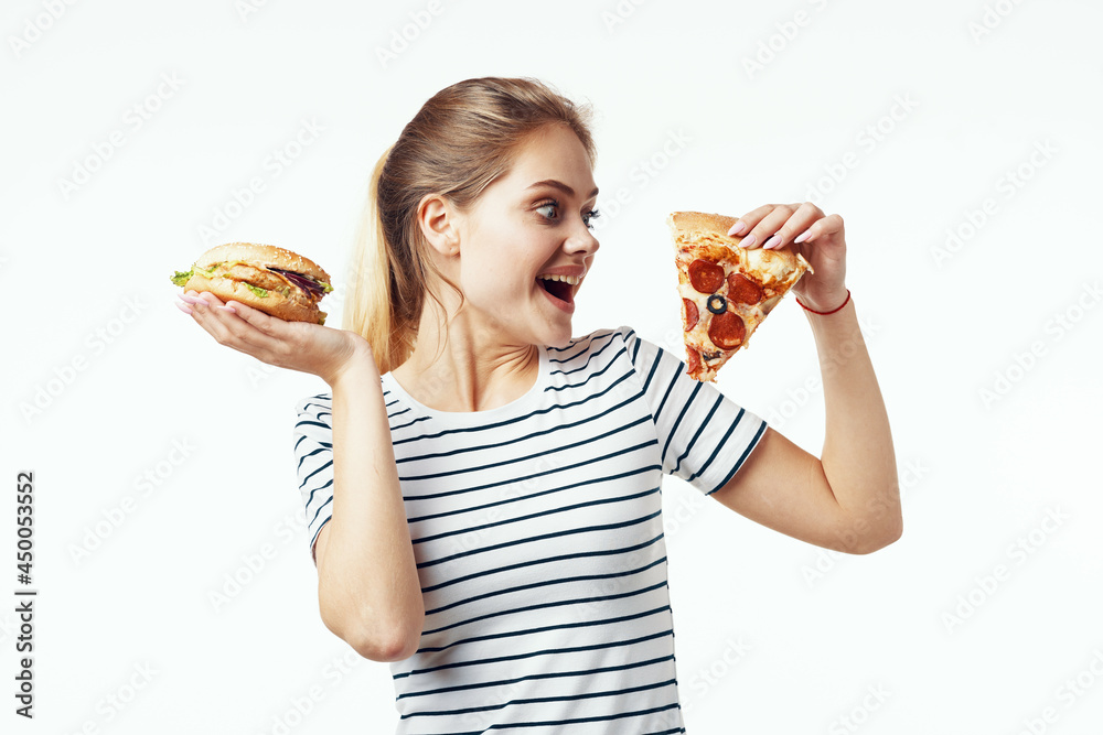 woman in striped t-shirt fast food snack junk food woman in striped t-shirt fast food snack junk food