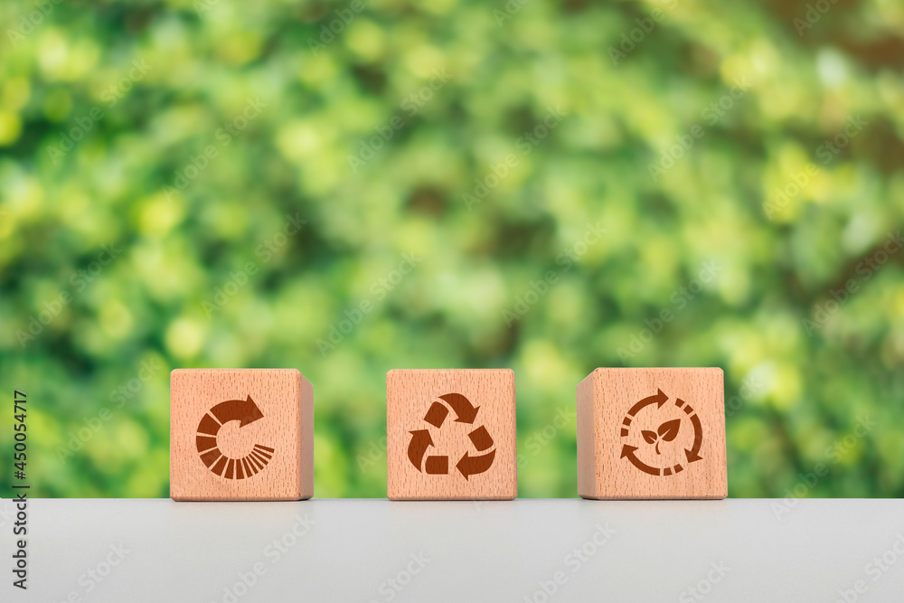 Environment and recycling concept, wooden cube blocks with recycling symbol Environment and recycling concept, wooden cube blocks with recycling symbol