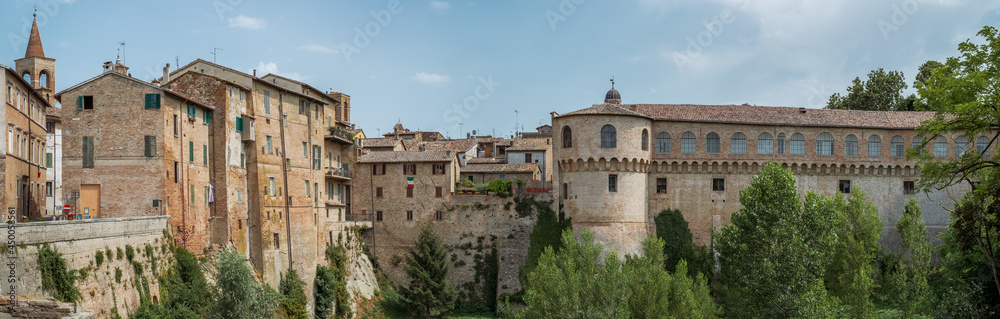 Houses and the Ducal Palace of Urbania overlooking the Metauro River, Pesaro and Urbino province, Marche, Italy.