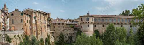 Houses and the Ducal Palace of Urbania overlooking the Metauro River, Pesaro and Urbino province, Marche, Italy.