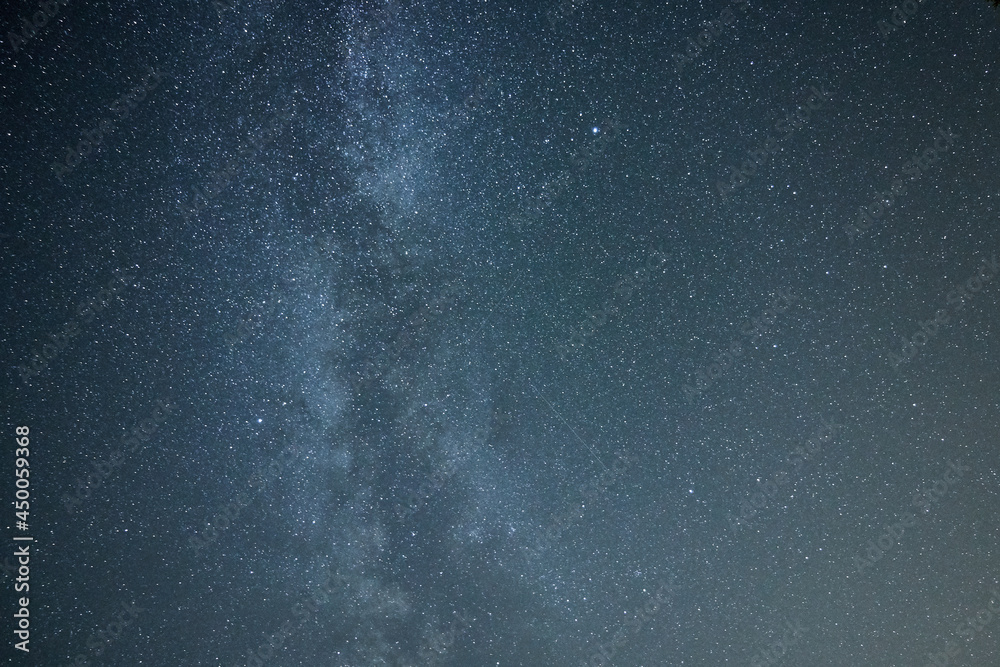 Starry blue night sky with the milky way galaxy.