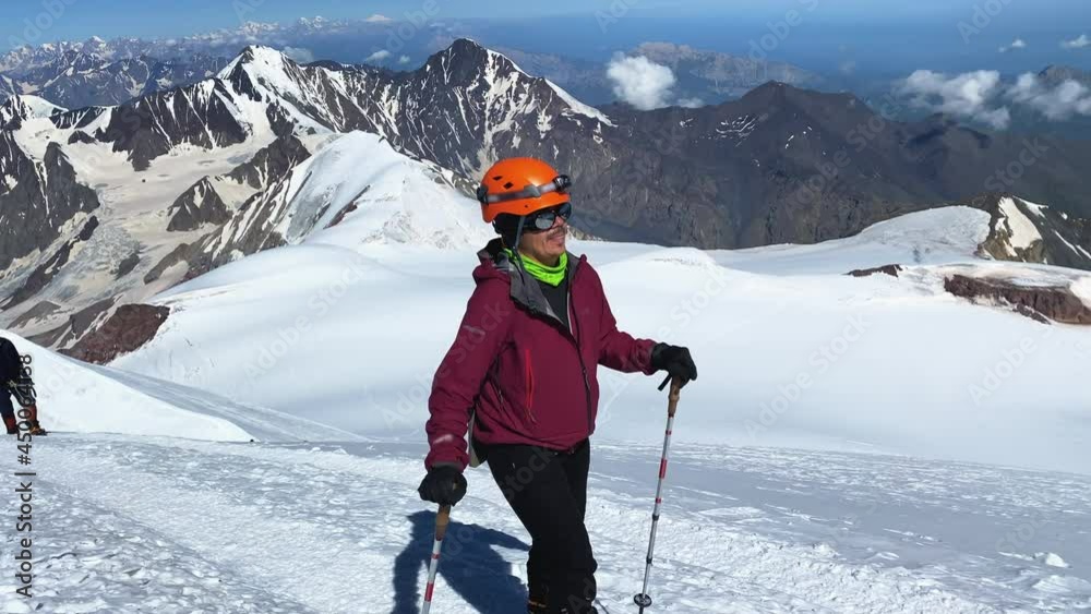 Climber on the top of Mount Kazbek. Climbing Kazbek from the north, from the side of Russia. Amazing mountains, rocks and hills. Hike across the Caucasus. Climber on the top of Mount Kazbek. Climbing Kazbek from the north, from the side of Russia. Amazing mountains, rocks and hills. Hike across the Caucasus.