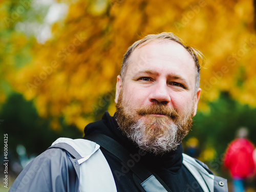 Adult Handsome bearded man outdoors portrait in autumn park © lenaivanova2311