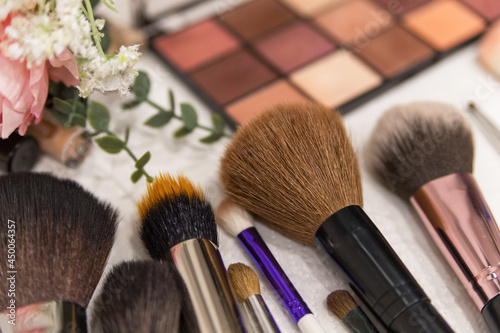 Make up the most necessary things. A set of brushes and professional cosmetics on the makeup artist's desk. Everything for applying makeup. Suitable for your beauty blog. Flatly. Soft focus.