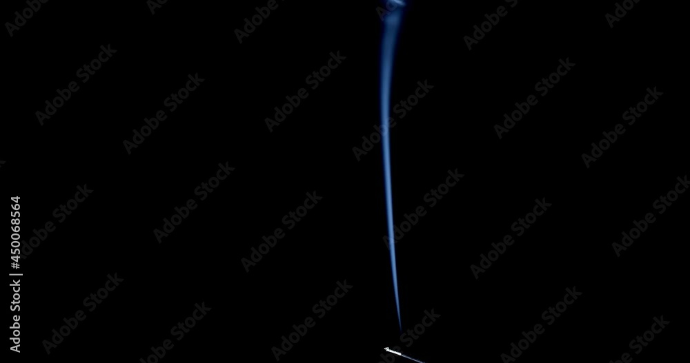 Thin Flexible Trickle of Smoke. Graceful Bends of the Blue Smoke. Natural Colorful smoke rises up and spins into graceful spirals. Footage is perfect for the layer with different blending modes. Thin Flexible Trickle of Smoke. Graceful Bends of the Blue Smoke. Natural Colorful smoke rises up and spins into graceful spirals. Footage is perfect for the layer with different blending modes.