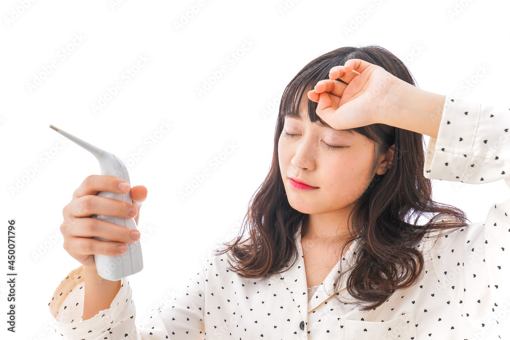 風邪をひいた若い女性 風邪をひいた若い女性