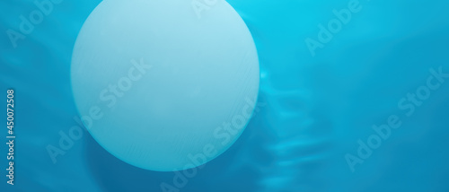 Abstract nature background for product presentation..Empty white circle podium on blue water texture with waves in sunlight. layout, copyspace
