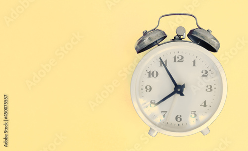 alarm clock on colorful background, hard time to start,wake up,