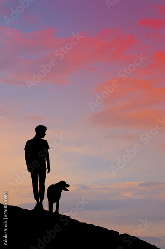 man on mountain with her dog
