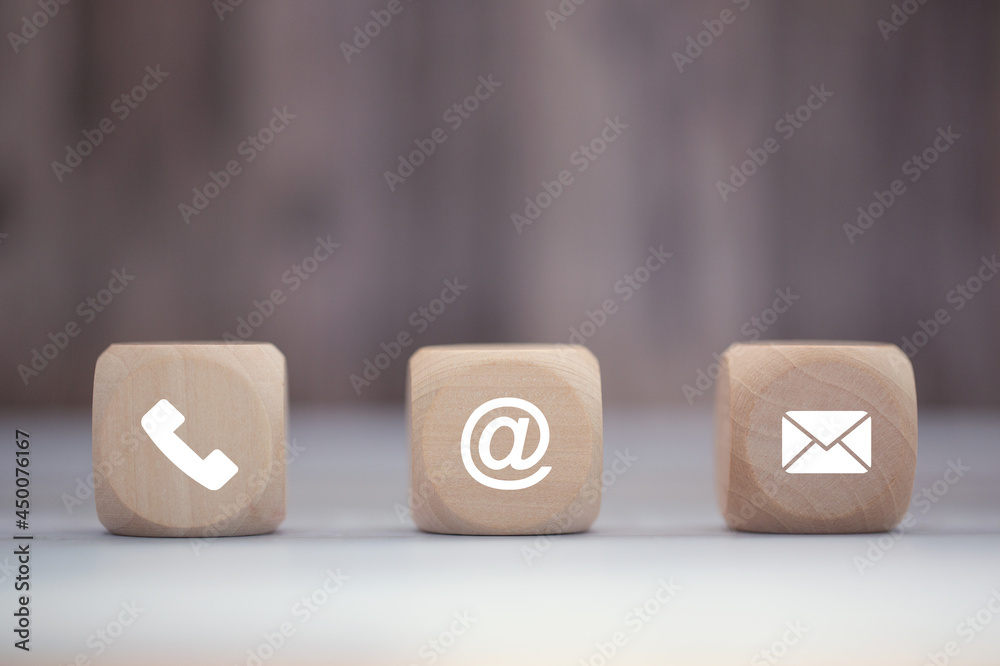 Contact us icon (phone, email, mail ) on wood block. customer service, help desk and support concept