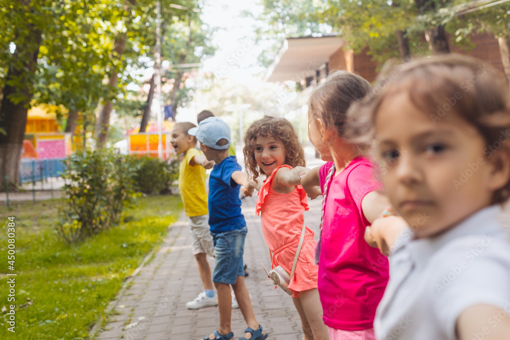 Lovely children playing outdoors at summer camp Lovely children playing outdoors at summer camp