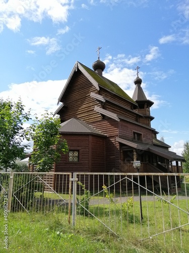 Nikolskoye ,Leningrad region, Russia-August, 8, 2021. beautiful old wooden church on a sunny summer day.church of St. Nicholas the wonderworker