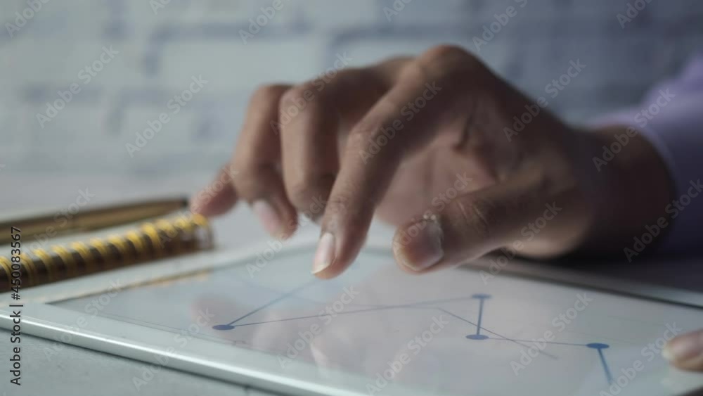 analyzing stock market data on digital tablet analyzing stock market data on digital tablet